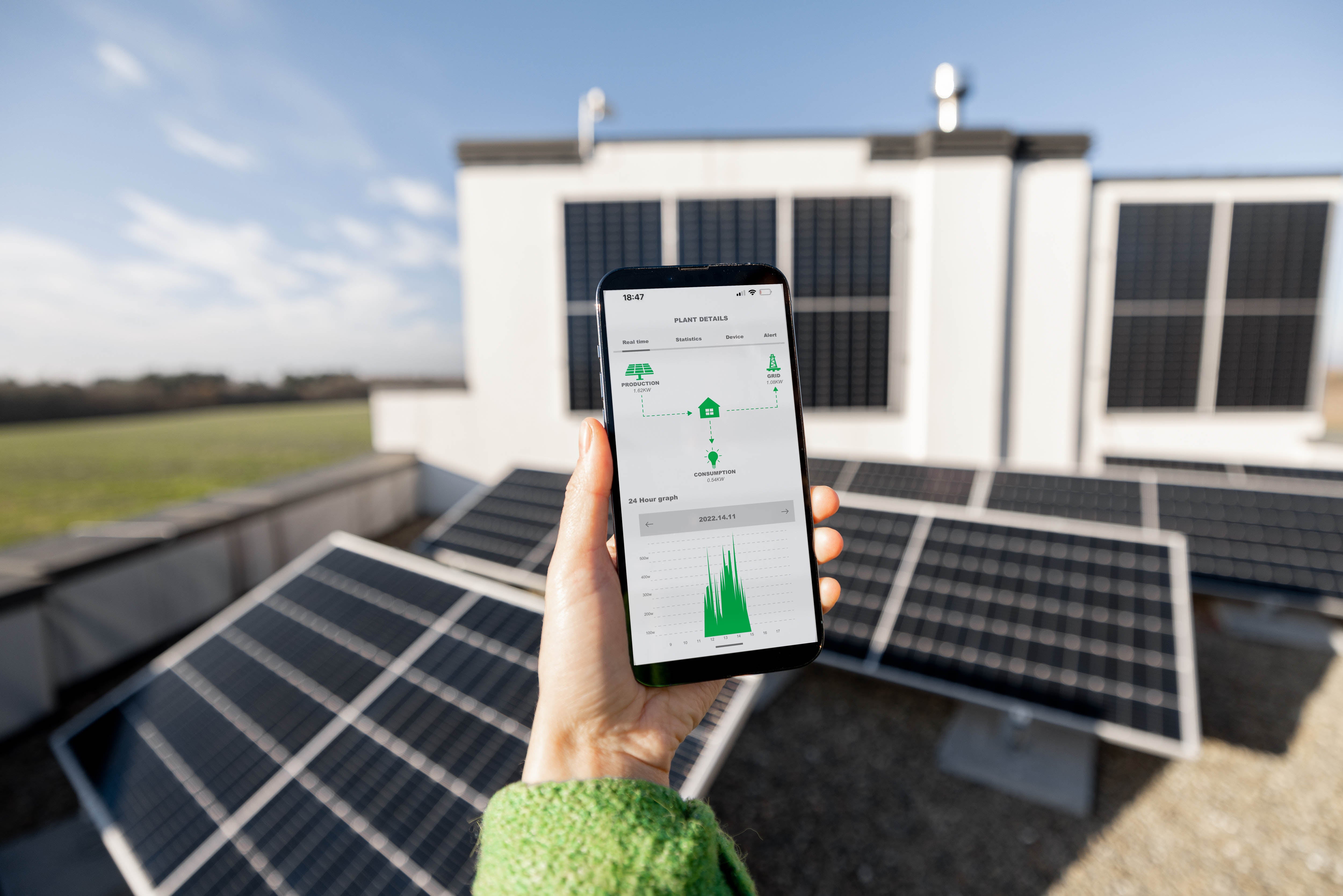 Monitoring solar energy production data on a smartphone app near solar panels