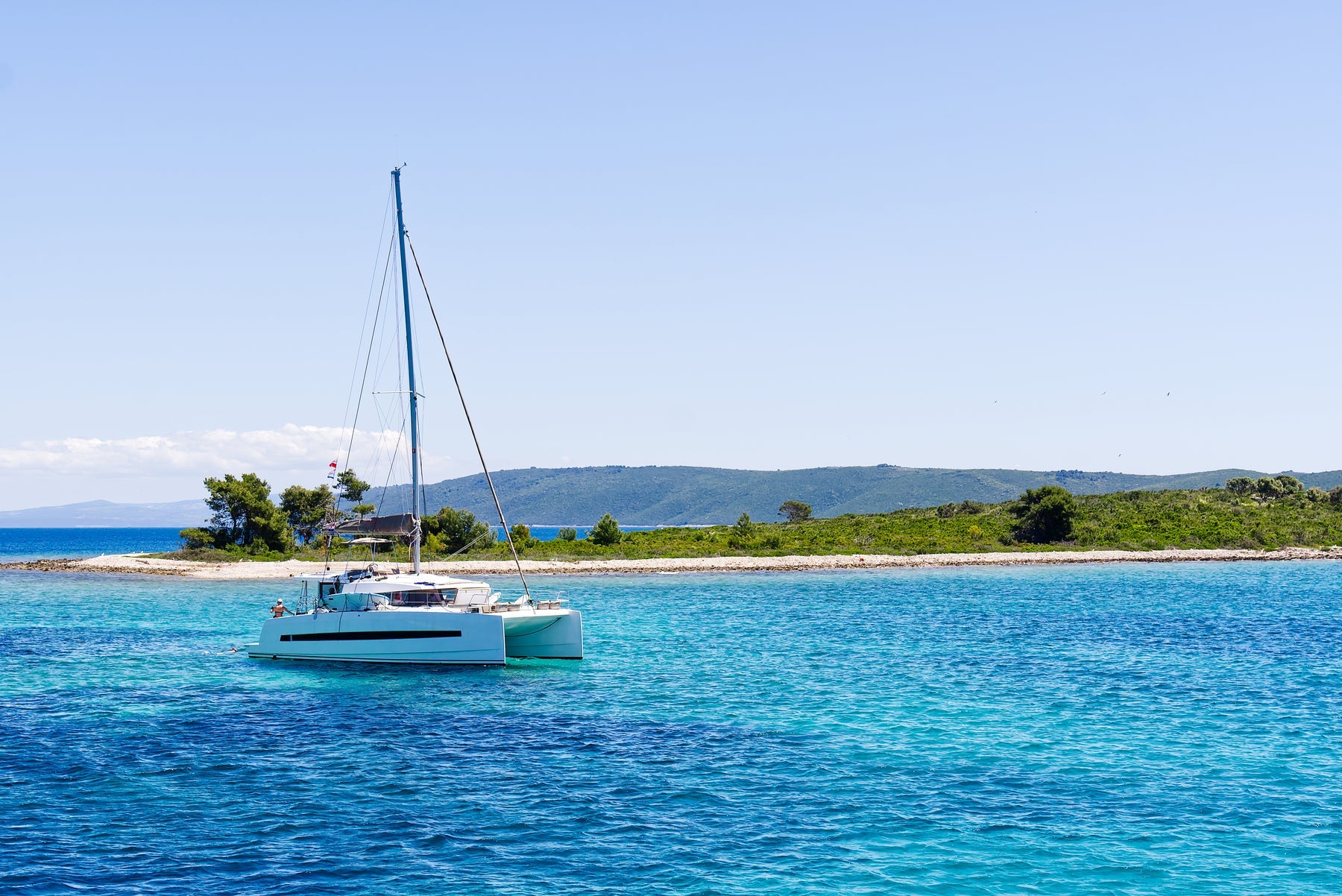 Cruising catamaran under sail with deck space suited for solar panels