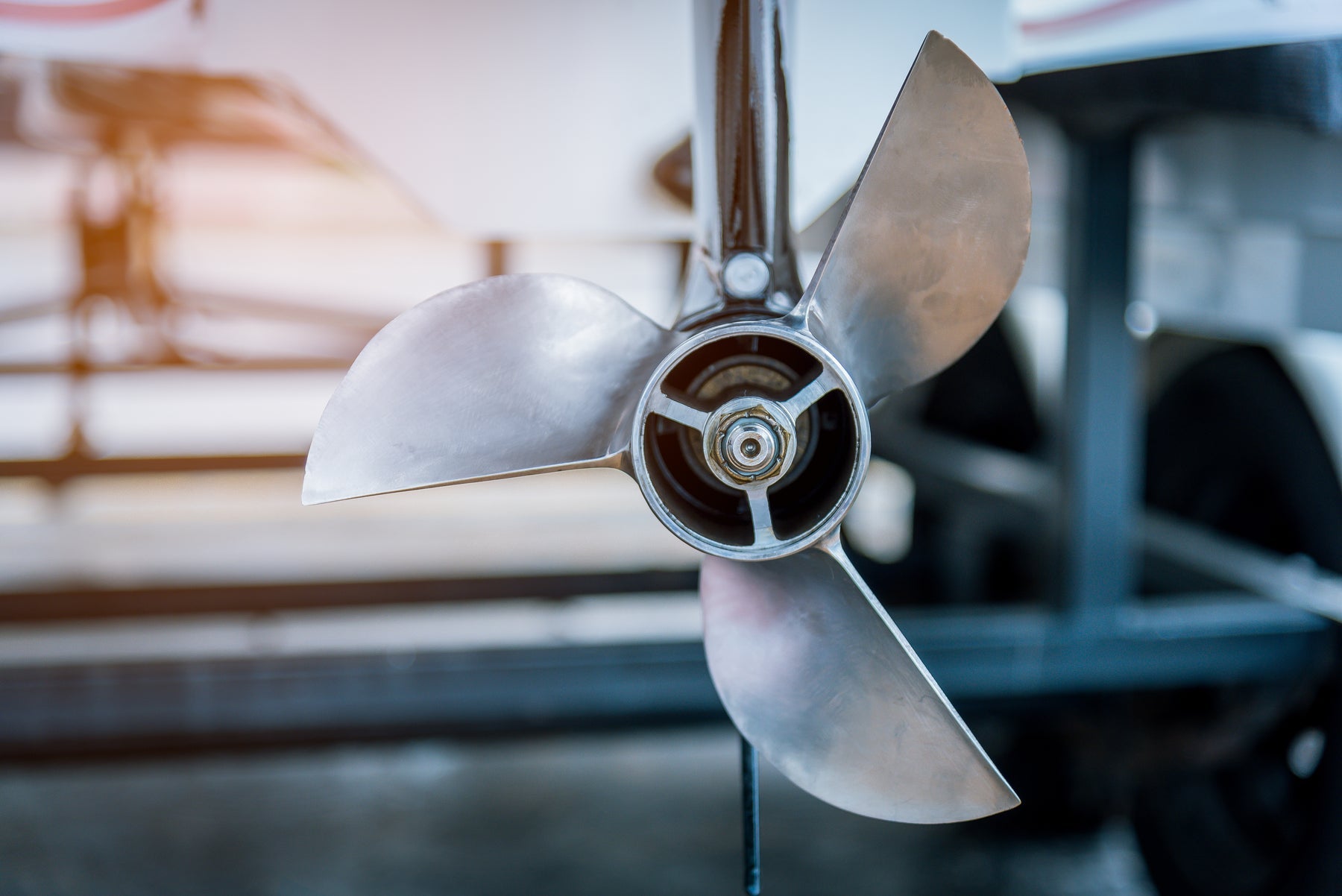 Close up of a boat propeller catching rays of sunlight